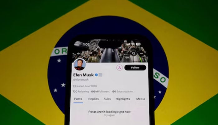 The X account of Elon Musk in seen blocked on a mobile screen in this illustration with Brazils flag in the background. — Reuters/File