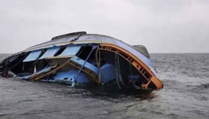 A boat seen capsized in this image.— AFP/file