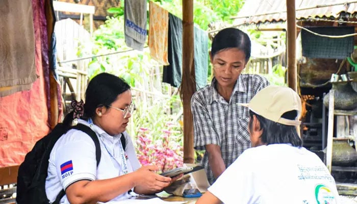 Census enumerators collecting information during a national census in Naypyidaw on Oct 1, 2024. — AFP