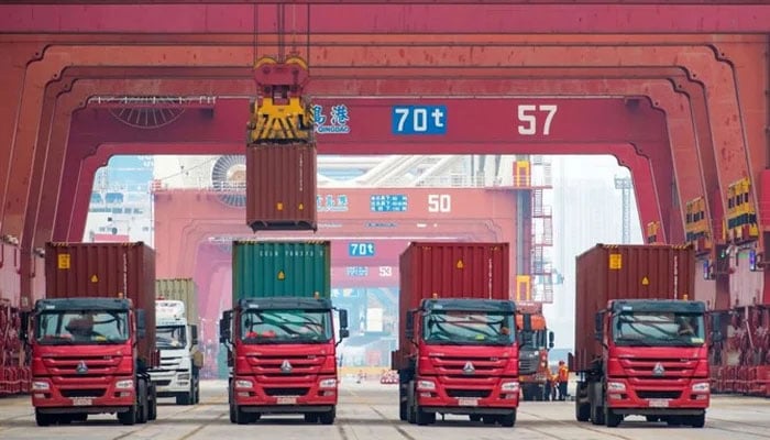 A representational image of containers being loaded on to trucks at  a Chinese port in this image.—AFP/File