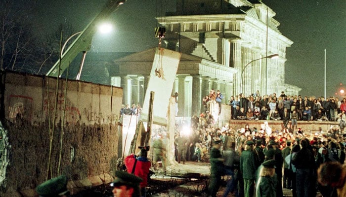 People gathered around the Berlin wall in Germany.— Reuters/file