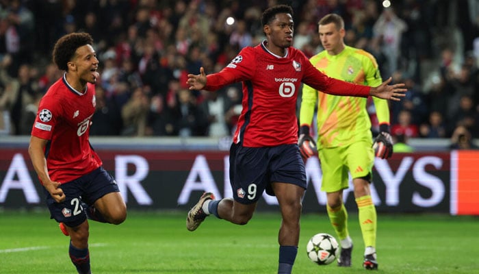 Jonathan David (centre) celebrating after scoring a penalty. — AFP/file