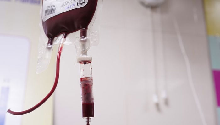 The representational image shows a blood transfusion in process at a hospital. — AFP/File