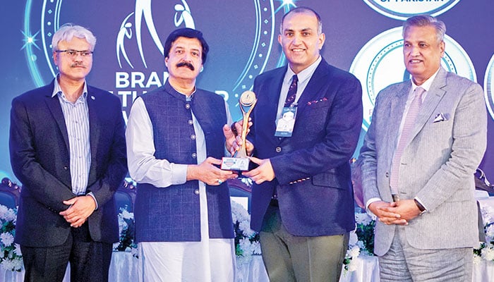 The image shows Dr. Faisal Mushtaq TI, Chairman & CEO of The Millennium Education Group, Pakistan, receiving the prestigious award from Governor of Punjab, Sardar Saleem Haider Khan, during a ceremony held in Islamabad on Oct 3, 2024. — TME/File