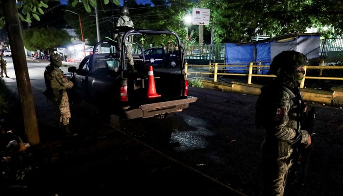 Soldiers keep watch outside a hospital where migrants injured were transferred after Mexican soldiers fired on a group of 33 migrants traveling in a pick-up truck that had tried to evade a military patrol, in Tapachula, Mexico October 2, 2024. — Reuters