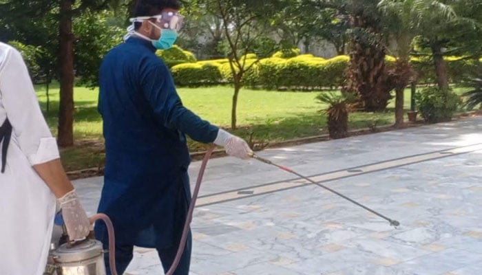 A team of the District Health Office Islamabad seen busy in anti-dengue spraying as part of intensive sweep activities in the federal capital, on Sept 30, 2024. — Facebook/DhoIslamabad