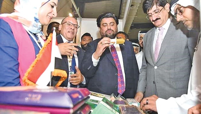 Sindh Governor Kamran Tessori and Chief Minister Syed Murad Ali Shah checking out dates at a stall at the First Pakistan International Date Palm Festival being held at the Karachi Expo Centre — The News photo by Shoaib Ahmed