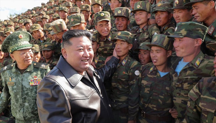 North Korean leader Kim Jong Un (centre L) . — AFP/file