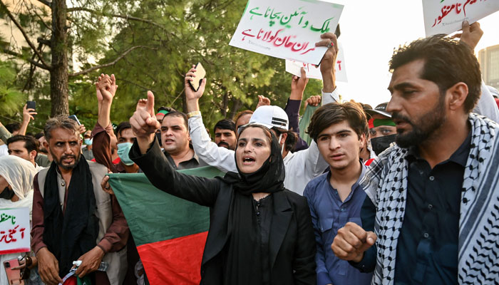 Supporters and activists of the PTI shout slogans during a protest in Islamabad on October 4, 2024. — AFP