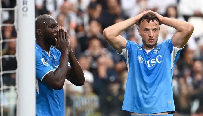 Napolis Belgian forward #11 Romelu Lukaku (L) and Napolis Kosovan defender #13 Amir Rrahmani react after a missing a goal opportunity during the Italian Serie A football match between Juventus and Napoli on September 21, 2024 at the Juventus stadium in Turin. — AFP