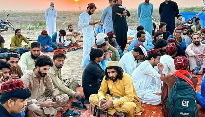 The undated image shows activists of Qaumi Watan Party (QWP) sitting together. — Facebook/PEDMOfficial