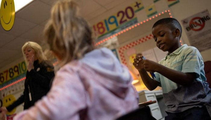 An immigrant student attends first-grade teacher Dana Smiths class at the public elementary school in Charleroi, Pennsylvania, U.S., September 25, 2024. — REUTERS