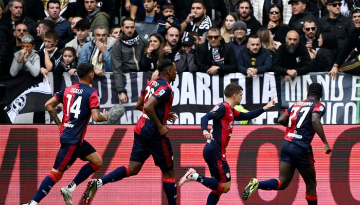 Razvan Marin (second right) celebrates his penalty which earned Cagliari a 1-1 draw at Juventus. — AFP/file