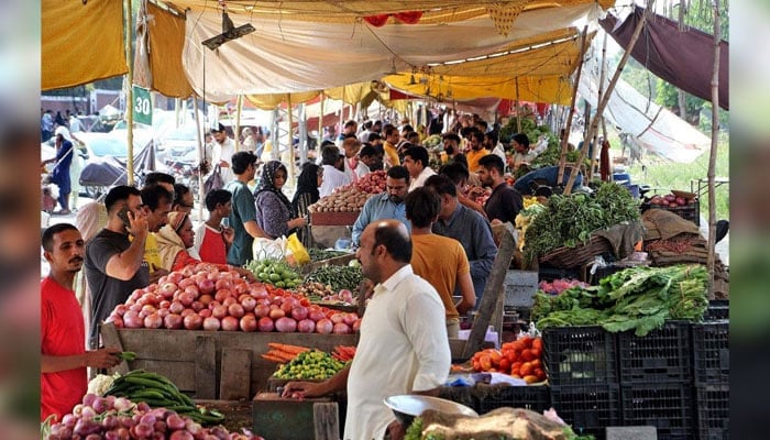 People buy vegetables and fruits at a weekly Bazar located in the Shadman area of Lahore on September 22, 2024. — PPI