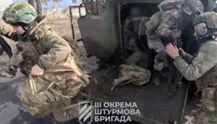 Ukrainian soldiers get out of a military vehicle in a location given as Avdiivka, Donetsk Region, Ukraine, in this screen grab taken from a video released February 17, 2024. — Reuters