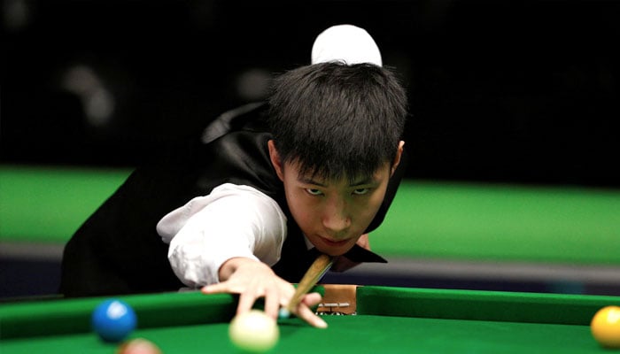 Zhao Xintong in action during his First Round Match. — Reuters/file