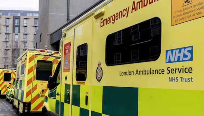 A representational image showing NHS ambulances parked along a street in London. — Reuters/File