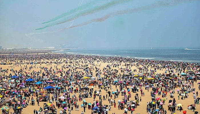 Surya Kiran Aerobatics Team of the Indian Air Force (IAF) perform an airshow during celebrations ahead of the Indian Air Force day at Marina beach in Chennai on October 6, 2024. — AFP