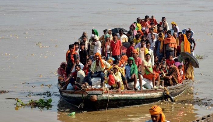 Flood affected people are travelling to safe place in Patna, India. — AFP/file