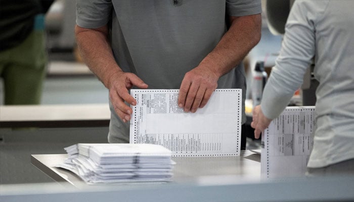 An election worker processes ballots at Philadelphias vote counting facility on Pennsylvanias primary election day in Philadelphia, Pennsylvania, US April 23, 2024. — Reuters