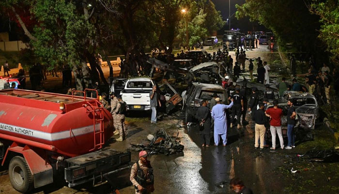 Security officials examined the explosion site near Karachi airport on late October 6, 2024. — AFP