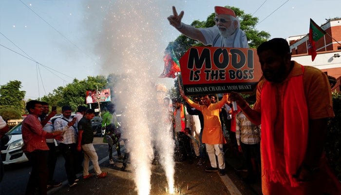 Bharatiya Janata Party (BJP) supporters celebrate outside the BJP headquarters, as the BJP leads in the election results in the northern state of Haryana, in New Delhi, India, October 8, 2024. — Reuters