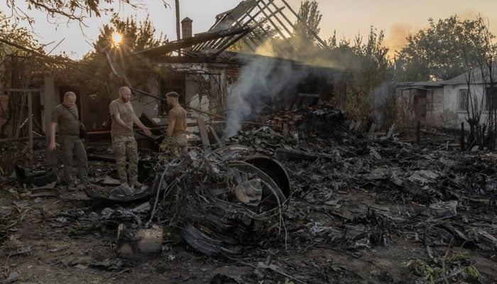 Military officers seen after a Ukrainian missile attack on Russian-occupied territory near Donetsk on October 3,2024. — AFP