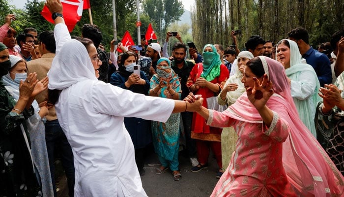 Supporters of the Jammu and Kashmir National Conference party celebrate outside the vote counting centre on the day of the assembly election results, in Srinagar, October 8, 2024. — Reuters