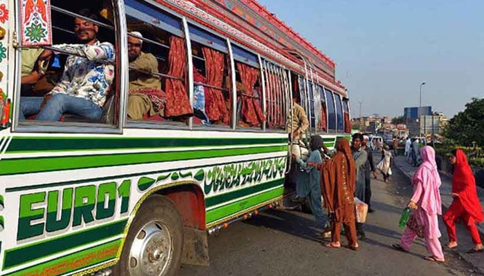 Women seen getting on a bus.— The News/file