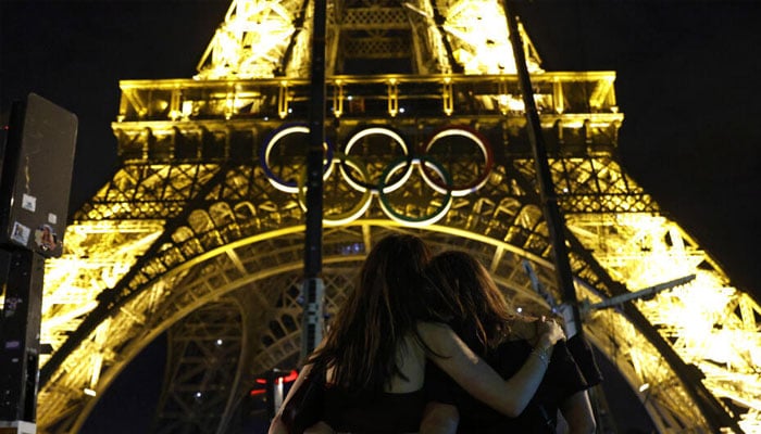 A couple seen in front of the Eifel Tower.— AFP/file