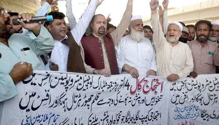 Members of the United Municipal Workers Union as they holding a protest demonstration against non-payment of their salaries and pensions, outside the KPK Assembly in Peshawar on October 9, 2024. — PPI