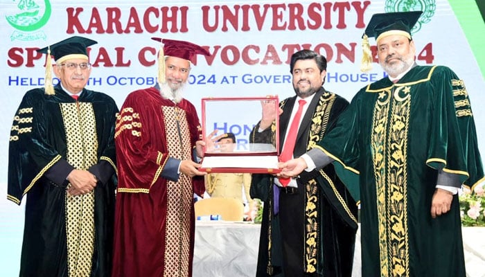 (from right)  KU Vice-Chancellor Dr Khalid Iraqi and  Sindh Governor Kamran Khan Tessori present the doctorate degree to globally renowned Islamic scholar Dr Zakir Naik at a special convocation ceremony of the University of Karachi at Governor House on October 9, 2024. — X/@KamranTessoriPk