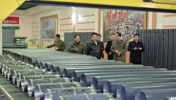 This photo taken on Feb 14, 2024 and released by North Koreas official Korean Central News Agency (KCNA) shows North Korean leader Kim Jong Un (C) inspecting a major munitions factory at an undisclosed location in North Korea. — AFP