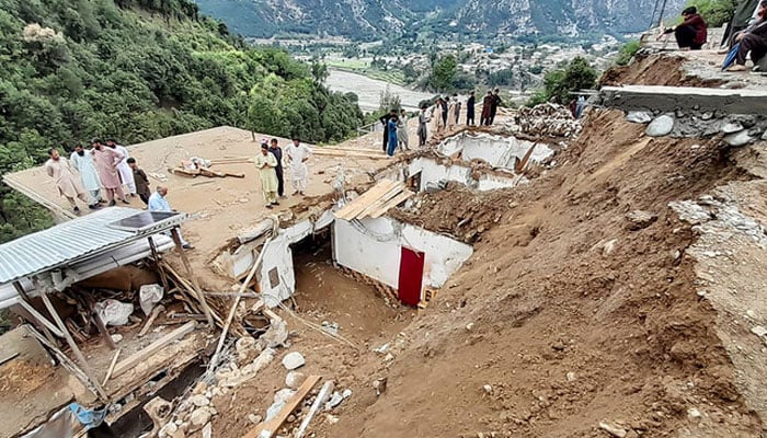 In this file photo, taken on August 30, 2024, residents gather at the site of a landslide owing to heavy monsoon rains in the remote area of Patrak, in Upper Dir district, Khyber Pakhtunkhwa province. — AFP