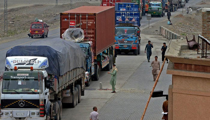 Trucks and other vehicles travel in the mountainous area near Torkham, close to the Pakistan-Afghanistan border. — AFP/File