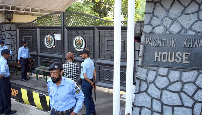 Police personals stands alert outside Khyber Pakhtunkhwa House after Officials of Capital Development Authority (CDA) sealed the KP house, in Islamabad on October 7, 2024. — Online