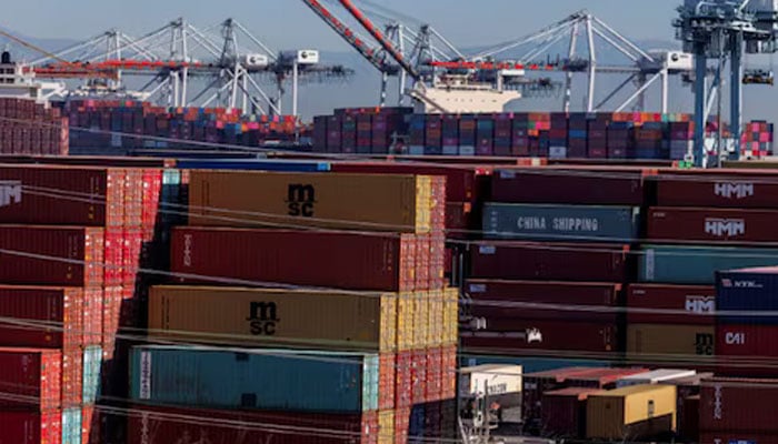 Stacked containers are shown as ships unload their cargo at the Port of Los Angeles in Los Angeles, California, US November 22, 2021. — Reuters