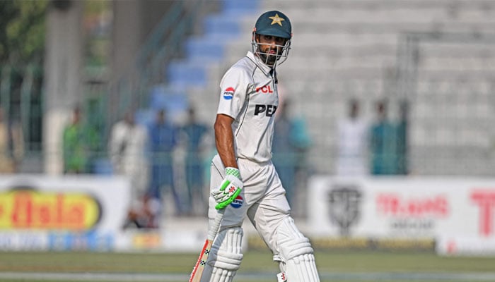 Pakistans captain Shan Masood walks back to the pavilion after his dismissal during the fourth day of the first Test cricket match between Pakistan and England at the Multan Cricket Stadium in Multan on October 10, 2024. — AFP