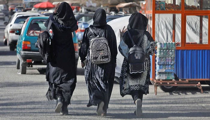 A representational image showing female students walking on a street. — Reuters/File