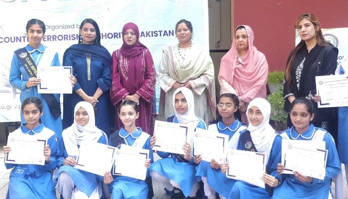 Participants pose for a group photo at a letter-writing activity organised by the National Counter Terrorism Authority (NACTA) at Islamabad Model College for Girls, F-6/2 on October 9, 2024. — Facebook/IMCG, Street # 25, F-6/2, Islamabad