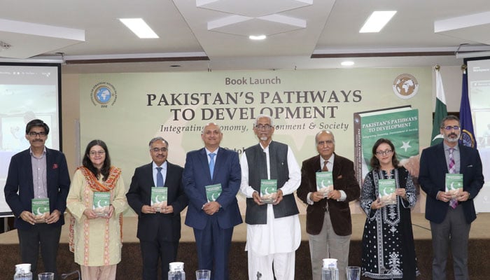 Participants post for a group photo at the launch of the edited book “Pakistan’s Pathways to Development: integrating economy, environment, & society” organised by the ISS on October 10, 2024. — Facebook/Institute of Strategic Studies Islamabad