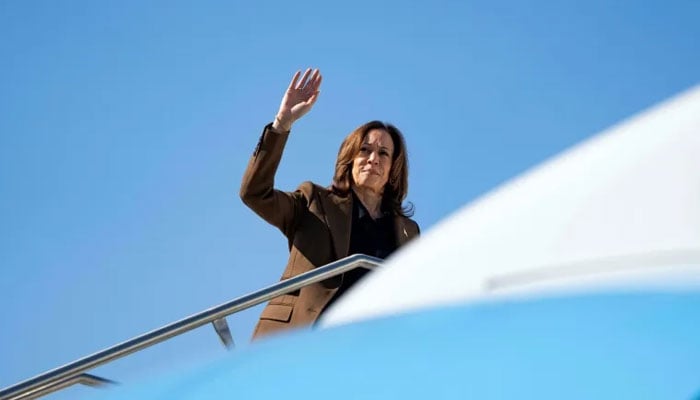 US Vice President and Democratic presidential candidate Kamala Harris waves as she boards Air Force Two from Sky Harbor International Airport in Phoenix, Arizona, on Oct 11, 2024. — AFP