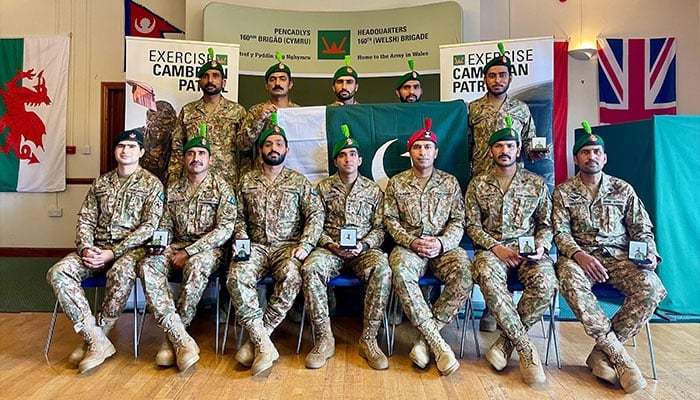 Pakistan Army team poses for a photo after winning gold at Exercise Cambrian Patrol 2024 in UK. — Reporter