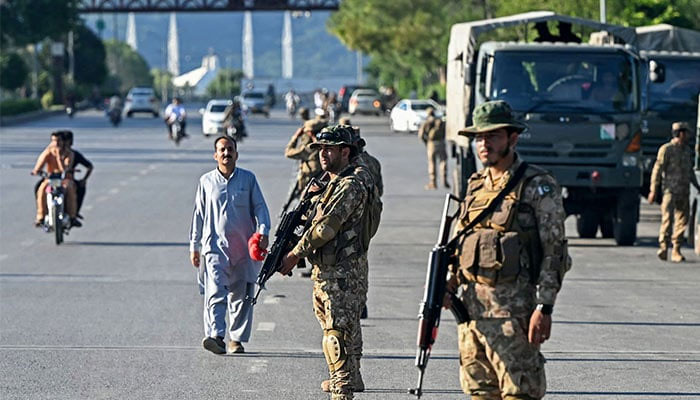 Pakistan Army soldiers stand guard in Islamabad on October 6, 2024. — AFP