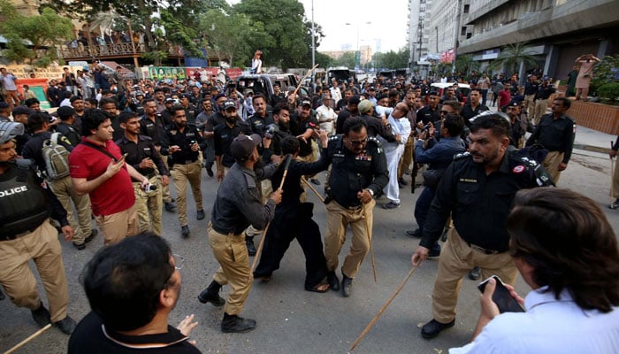 Police arrest the protesters for violating Section 144 during the Sindh Rawadari March protest demonstration of Civil Society outside Karachi Press Club on October 13, 2024. — PPI