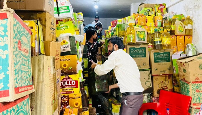 Sindh Food Authority officials raid a shop located in Qasimabad, Hyderabad on October 12, 2024. — Facebook/Sindh Food Authority