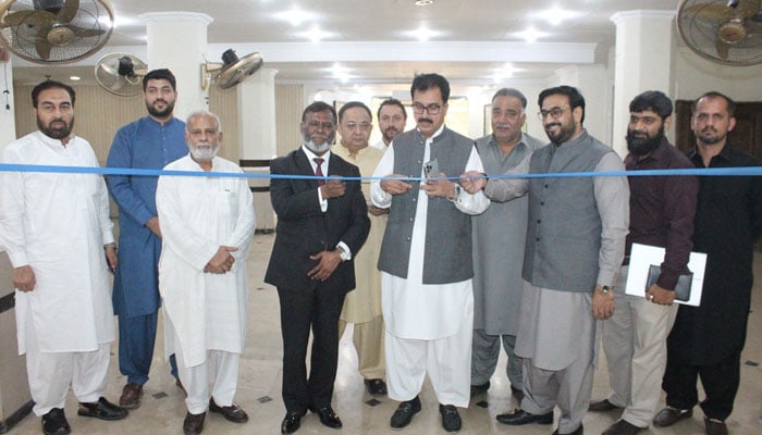 SCCI President Fazal Moqeem Khan (centre) and Vice President Shehryar Khan (centre to right) inaugurate a help desk on October 14, 2024. — Facebook/Sarhad Chamber Peshawar