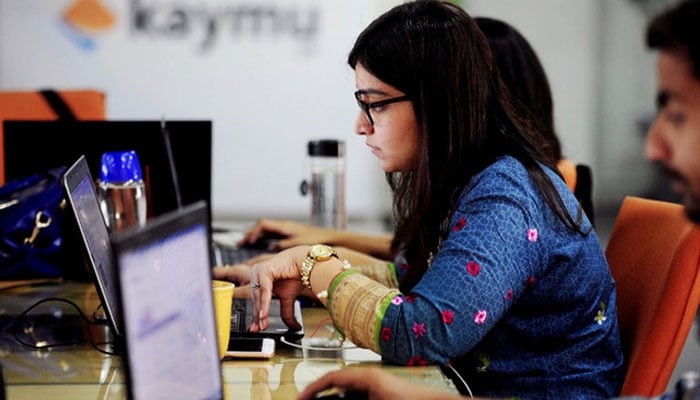 A representational image showing an employee working in an office. — AFP/File