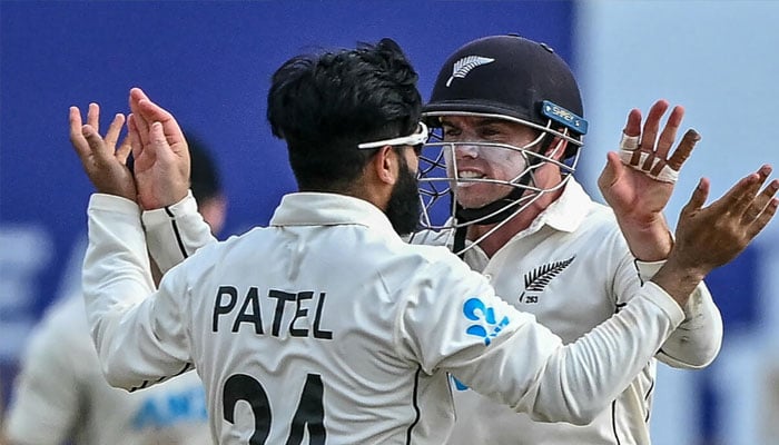 New Zealands Tom Latham (R) with his teammate Ajaz Patel. — AFP/file