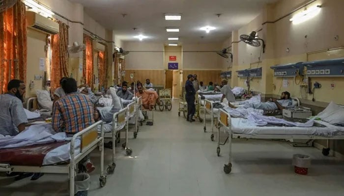 The representational image shows a male ward in a Pakistani hospital. — AFP/File